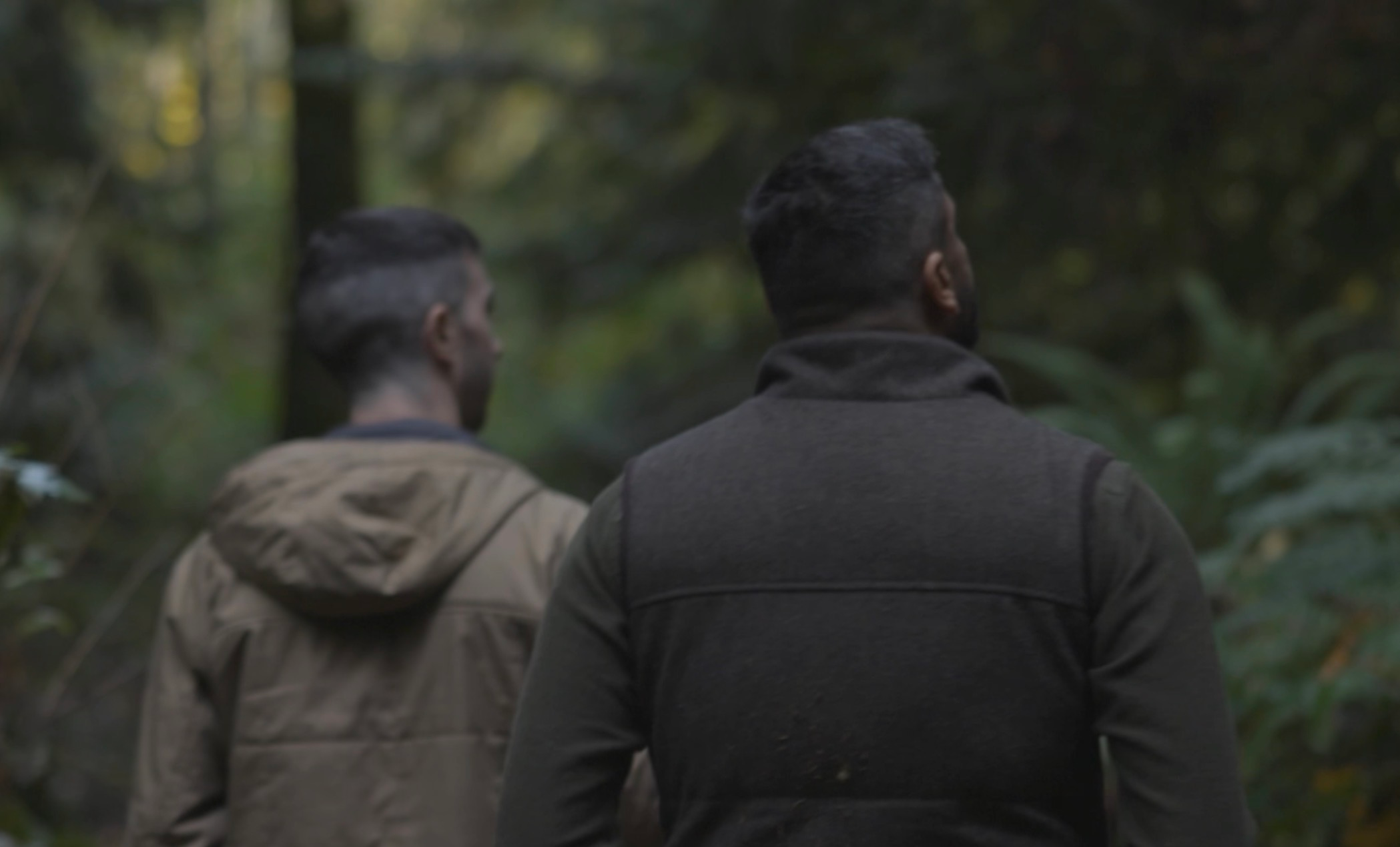 Two team members walking the Olympic rainforest at the Mother farm